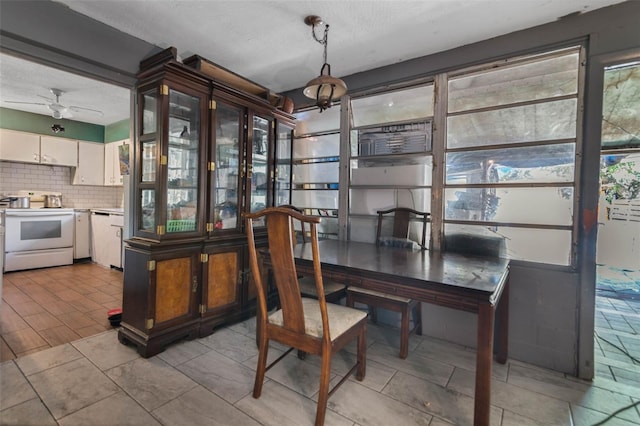 1136 Lakewood Park Dr, Daytona Beach, FL 32117 - dining room with a ceiling fan and plenty of natural light