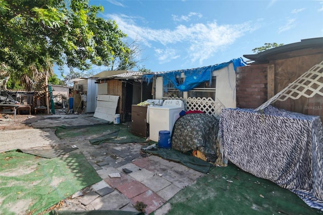 1136 Lakewood Park Dr, Daytona Beach, FL 32117 - exterior space with washer / dryer and a patio