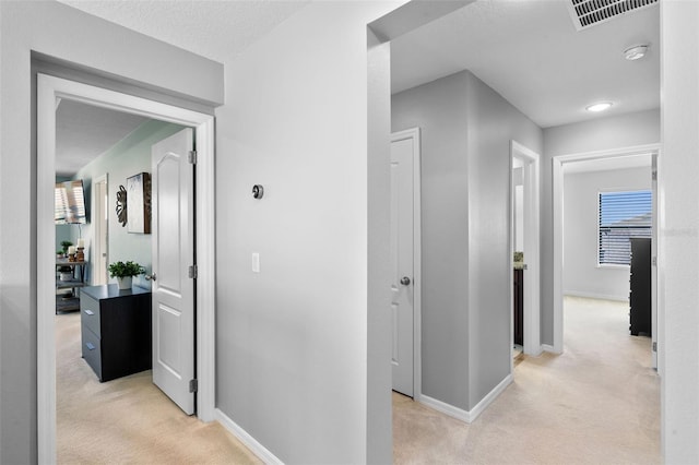4113 Longbow Dr, Clermont, FL 34711 - corridor with light colored carpet and baseboards