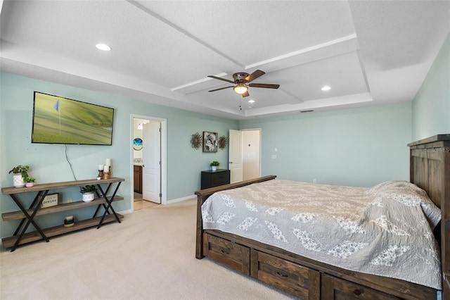 4113 Longbow Dr, Clermont, FL 34711 - bedroom featuring a tray ceiling, light colored carpet, baseboards, recessed lighting, and ensuite bath