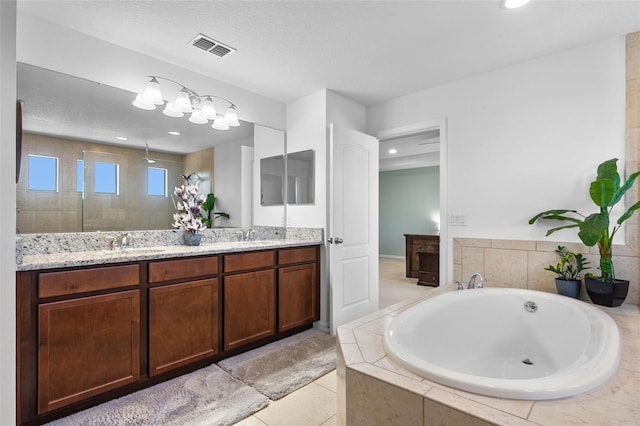 4113 Longbow Dr, Clermont, FL 34711 - bathroom with a bath, double vanity, tiled shower, tile patterned floors, and recessed lighting
