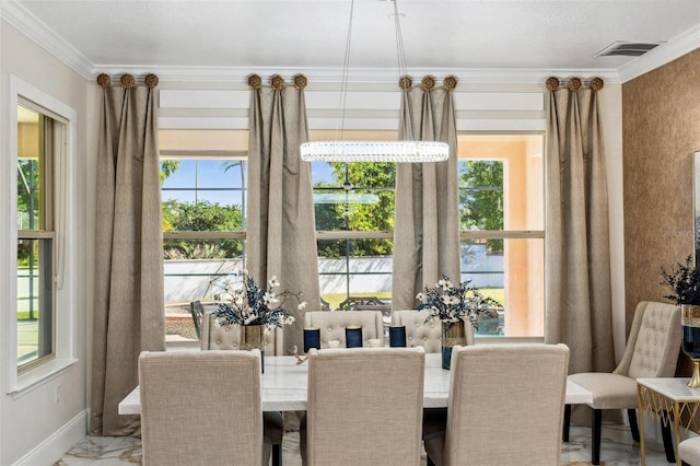 8625 Brixford St, Orlando, FL 32836 - dining space featuring ornamental molding, baseboards, marble finish floor, and a healthy amount of sunlight