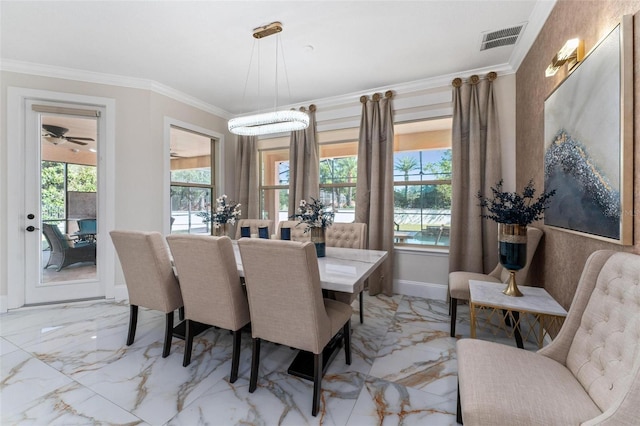 8625 Brixford St, Orlando, FL 32836 - dining room with marble finish floor, ornamental molding, visible vents, and plenty of natural light