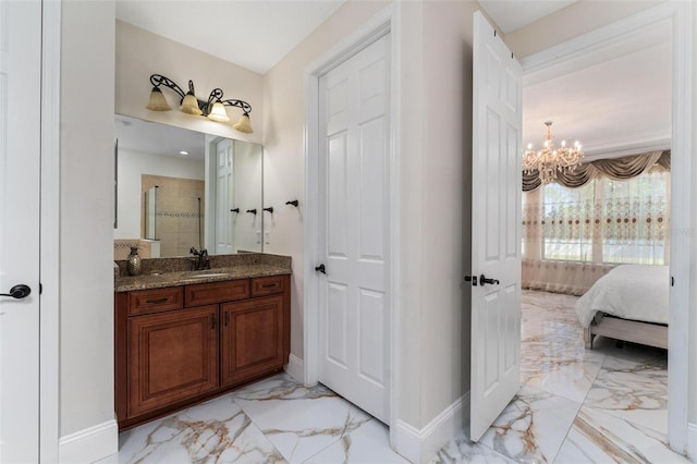 8625 Brixford St, Orlando, FL 32836 - bathroom with baseboards, a notable chandelier, a tile shower, vanity, and marble finish floor