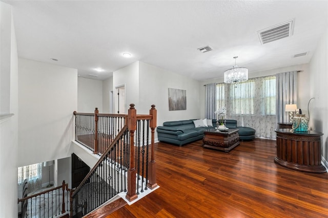 8625 Brixford St, Orlando, FL 32836 - living room featuring visible vents, an inviting chandelier, and wood finished floors