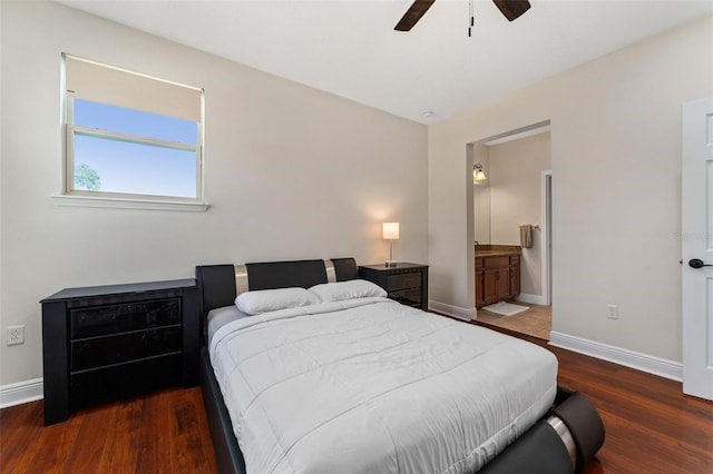 8625 Brixford St, Orlando, FL 32836 - bedroom featuring ceiling fan, baseboards, ensuite bathroom, and wood finished floors