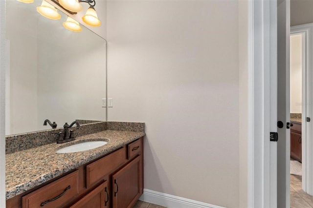 8625 Brixford St, Orlando, FL 32836 - bathroom featuring tile patterned floors, vanity, and baseboards
