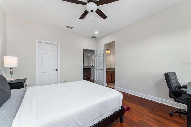 8625 Brixford St, Orlando, FL 32836 - bedroom with dark wood-type flooring, visible vents, baseboards, and ceiling fan