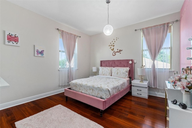 8625 Brixford St, Orlando, FL 32836 - bedroom with multiple windows, baseboards, and wood finished floors