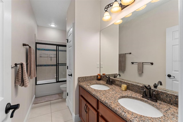 8625 Brixford St, Orlando, FL 32836 - bathroom with a sink, baseboards, double vanity, and tile patterned flooring