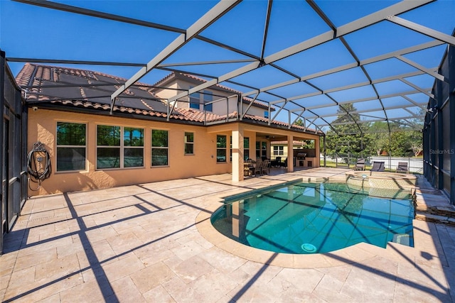 8625 Brixford St, Orlando, FL 32836 - view of swimming pool featuring a lanai, a patio, and a pool with connected hot tub