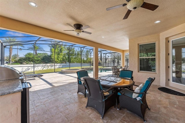 8625 Brixford St, Orlando, FL 32836 - view of patio with exterior kitchen, a ceiling fan, outdoor dining space, an outdoor pool, and a lanai