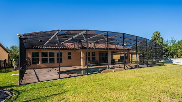 8625 Brixford St, Orlando, FL 32836 - back of house with a patio, stucco siding, a tile roof, glass enclosure, and fence