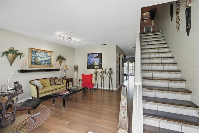 stairs featuring baseboards and wood finished floors