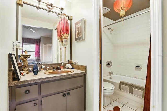 full bath with toilet, tile patterned floors, vanity, and bathtub / shower combination
