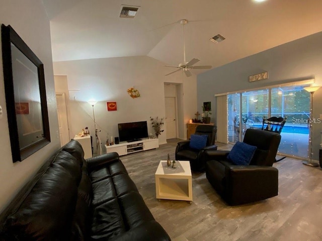 19430 SW 100th Loop, Dunnellon, FL 34432 - living room with wood finished floors, ceiling fan, and lofted ceiling