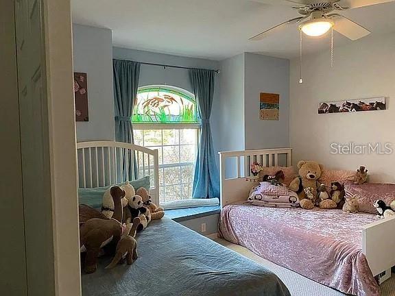 19430 SW 100th Loop, Dunnellon, FL 34432 - bedroom featuring a ceiling fan