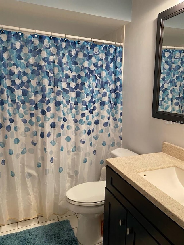 19430 SW 100th Loop, Dunnellon, FL 34432 - full bathroom with vanity, toilet, tile patterned flooring, and curtained shower
