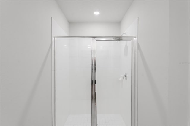 full bathroom featuring a shower stall and recessed lighting