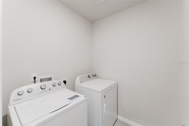 laundry area featuring washer and clothes dryer and laundry area