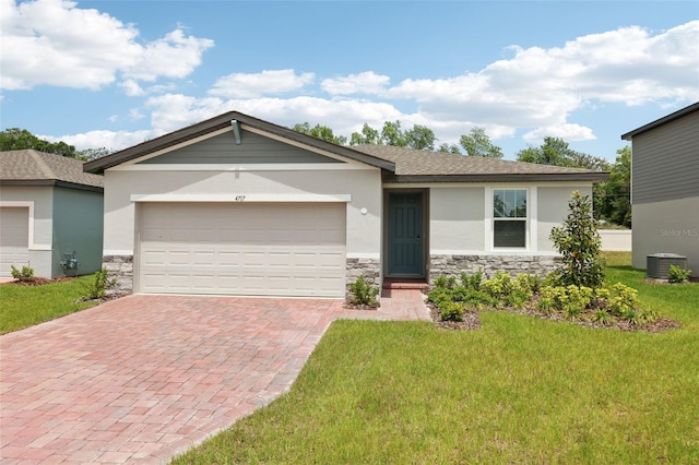 4717 Jasmine Cir, Leesburg, FL 34748 - ranch-style home with stone siding, stucco siding, and decorative driveway