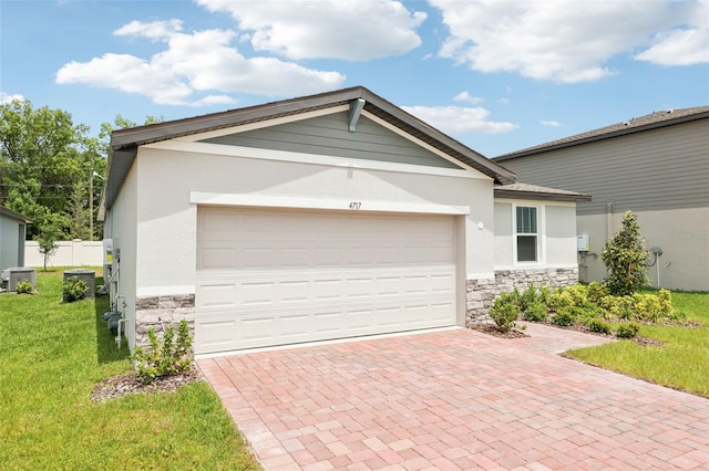 4717 Jasmine Cir, Leesburg, FL 34748 - garage featuring decorative driveway and cooling unit