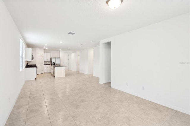 4717 Jasmine Cir, Leesburg, FL 34748 - unfurnished living room with baseboards, recessed lighting, and light tile patterned floors