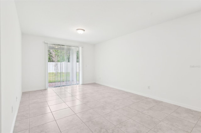 4717 Jasmine Cir, Leesburg, FL 34748 - unfurnished room featuring light tile patterned flooring and baseboards