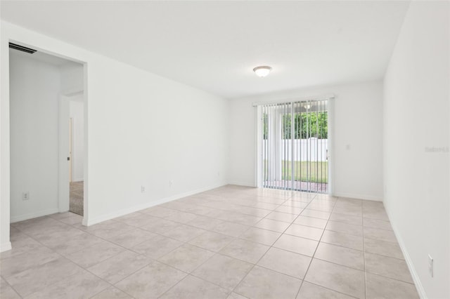 4717 Jasmine Cir, Leesburg, FL 34748 - spare room with light tile patterned floors and baseboards
