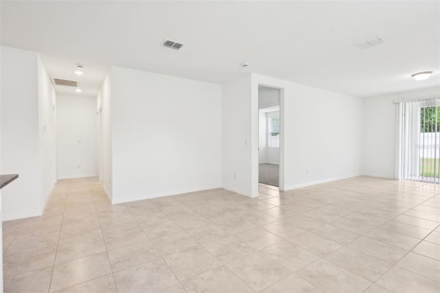 4717 Jasmine Cir, Leesburg, FL 34748 - spare room featuring light tile patterned floors and baseboards