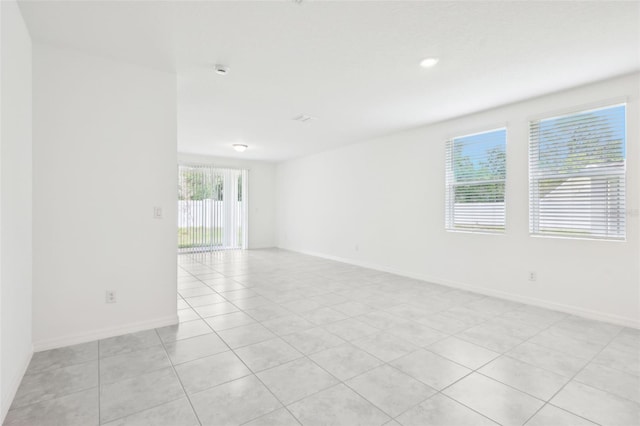 4717 Jasmine Cir, Leesburg, FL 34748 - unfurnished room with light tile patterned floors, baseboards, and recessed lighting