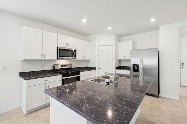 4717 Jasmine Cir, Leesburg, FL 34748 - kitchen with appliances with stainless steel finishes, a sink, baseboards, white cabinetry, and recessed lighting