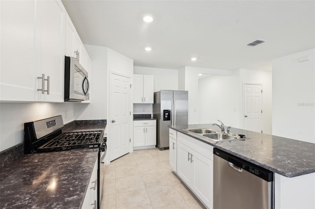 4717 Jasmine Cir, Leesburg, FL 34748 - kitchen featuring stainless steel appliances, a sink, an island with sink, white cabinets, and recessed lighting