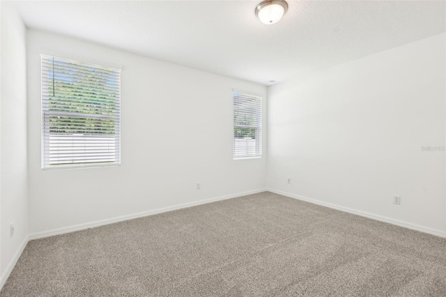 4717 Jasmine Cir, Leesburg, FL 34748 - empty room with carpet flooring and baseboards