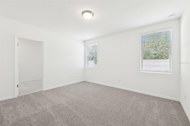4717 Jasmine Cir, Leesburg, FL 34748 - carpeted empty room featuring healthy amount of natural light and baseboards