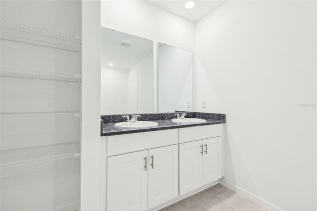 4717 Jasmine Cir, Leesburg, FL 34748 - full bath featuring double vanity, baseboards, tile patterned floors, and recessed lighting