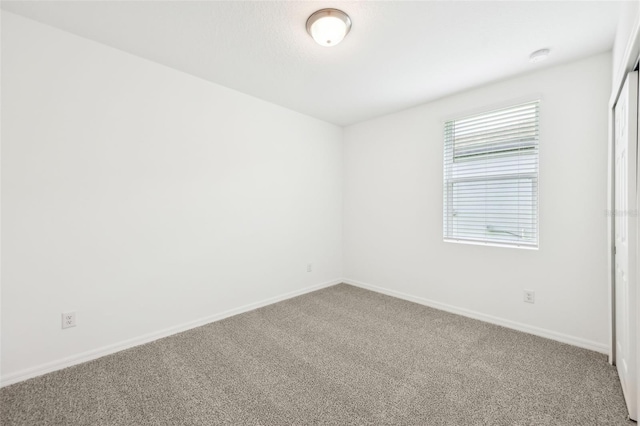 4717 Jasmine Cir, Leesburg, FL 34748 - carpeted spare room with baseboards