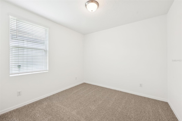 4717 Jasmine Cir, Leesburg, FL 34748 - carpeted spare room with baseboards