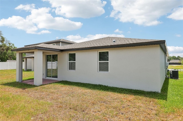 4717 Jasmine Cir, Leesburg, FL 34748 - rear view of house with stucco siding, central AC unit, a patio area, and roof with shingles