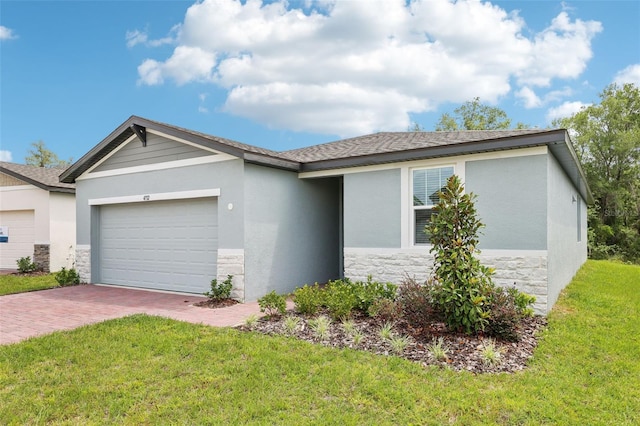 4732 Jasmine Cir, Leesburg, FL 34748 - single story home featuring stone siding, a garage, decorative driveway, and a front yard