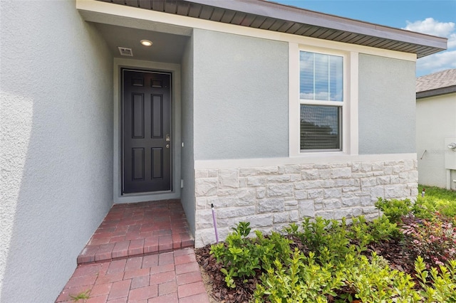 4732 Jasmine Cir, Leesburg, FL 34748 - view of exterior entry with stucco siding and stone siding