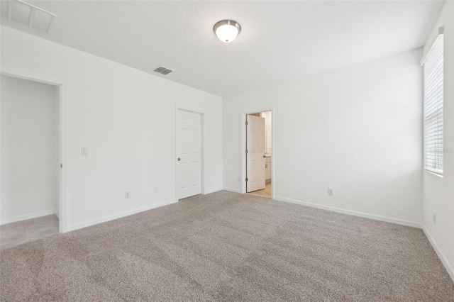 4732 Jasmine Cir, Leesburg, FL 34748 - spare room featuring light colored carpet and baseboards