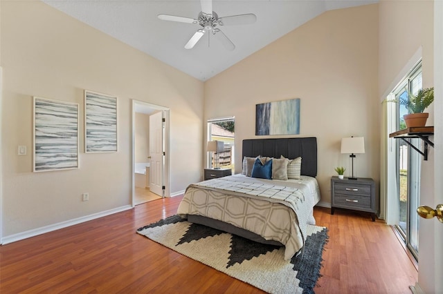 bedroom with light wood-type flooring, baseboards, high vaulted ceiling, and multiple windows