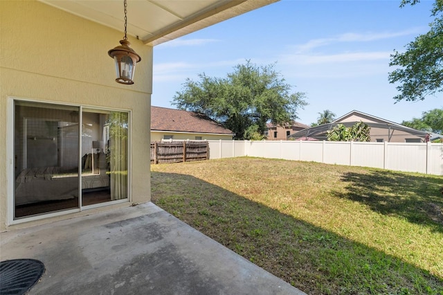 view of yard featuring a patio area and fence