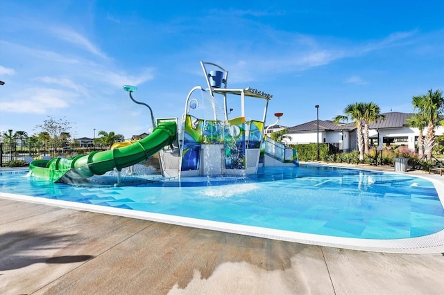 9179 Sommerset Hills Dr, Davenport, FL 33896 - community pool featuring a water slide and a water play area