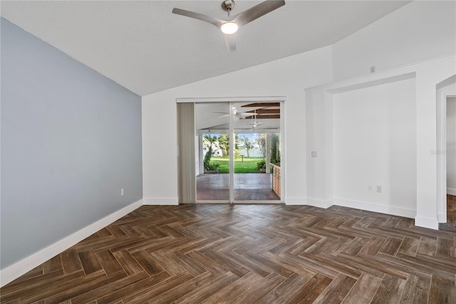empty room with baseboards, a ceiling fan, and lofted ceiling