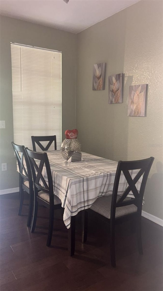5125 Palm Springs Blvd Unit 13107, Tampa, FL 33647 - dining space with dark wood-style flooring and baseboards