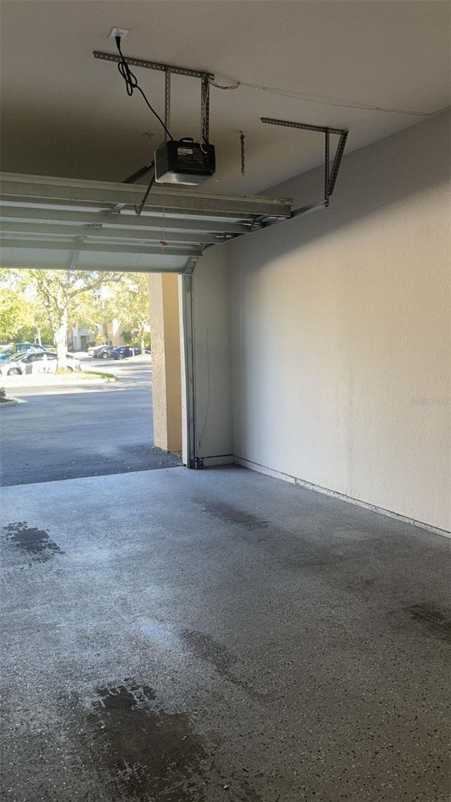 5125 Palm Springs Blvd Unit 13107, Tampa, FL 33647 - garage featuring a garage door opener