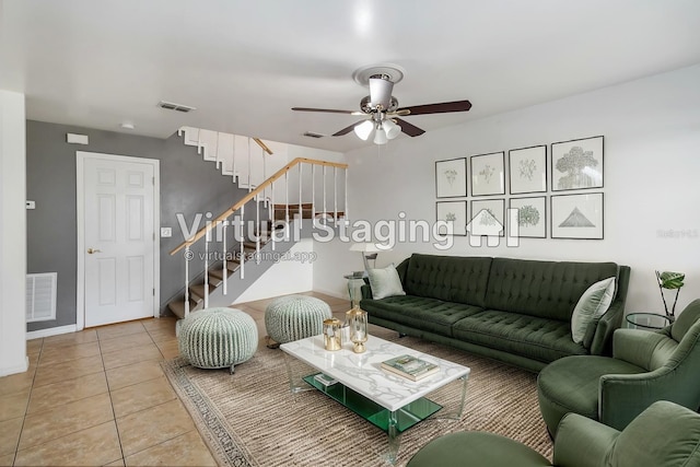 living room with visible vents, ceiling fan, stairway, and tile patterned floors