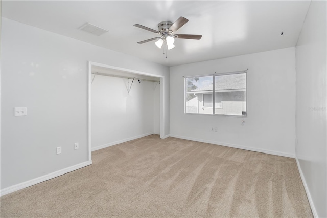 unfurnished bedroom featuring visible vents, a closet, baseboards, and carpet floors